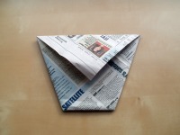 origami cup turned over and pressed