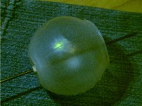 wire coat hanger through hole in laundry ball