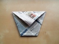 origami cup turned over and pressed