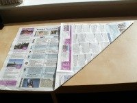 newspaper folded into a square